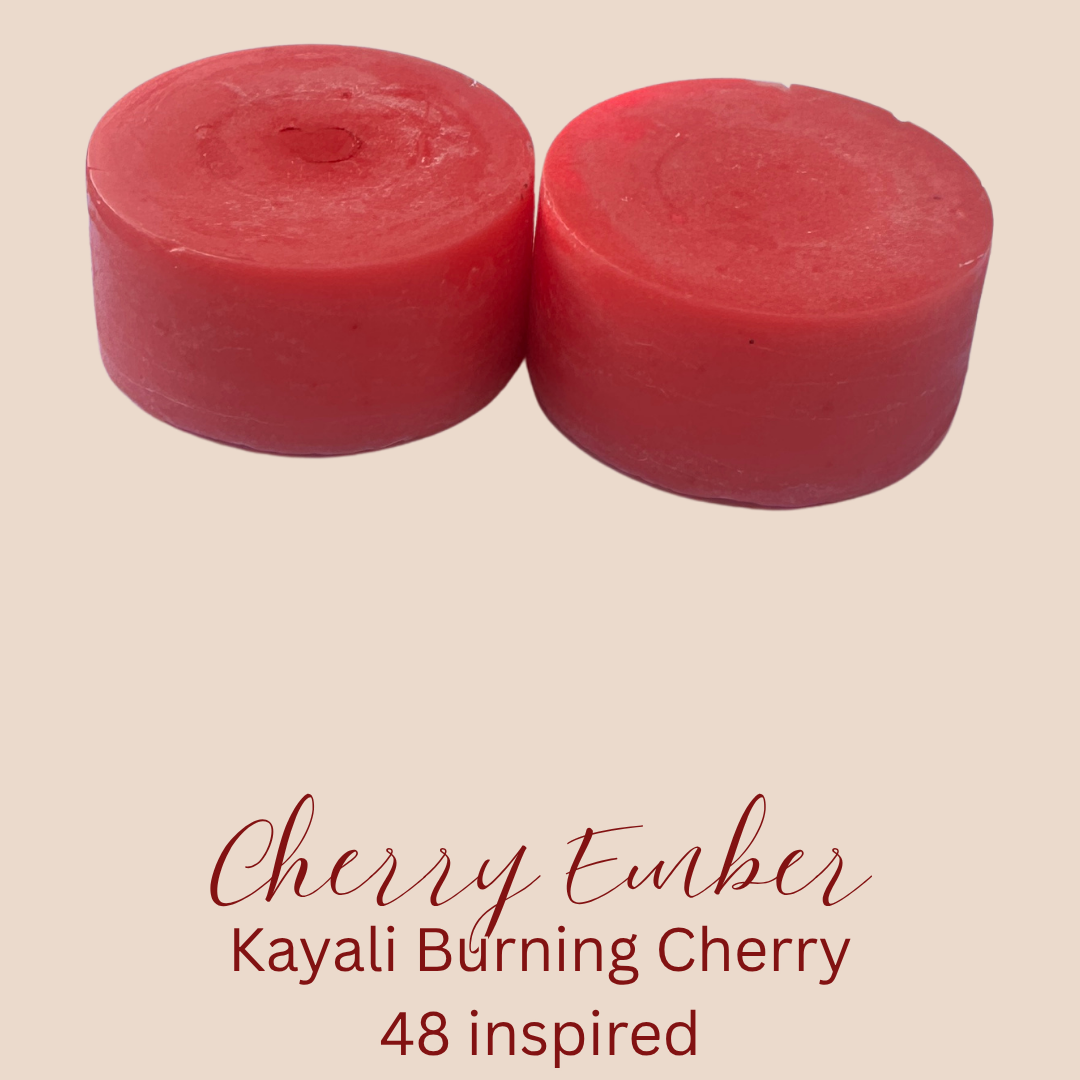 Two round red wax melts labeled 'Cherry Ember' on a beige background with text reading 'Kayali Burning Cherry' and '48 inspired'.