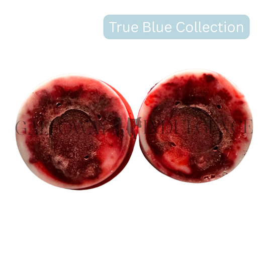 Two red marbled  wax melts. Australia's strongest, long-lasting and handmade wax melts fragranced in bush blossom. These melts are part of Galloway Indulgence's True blue collection.