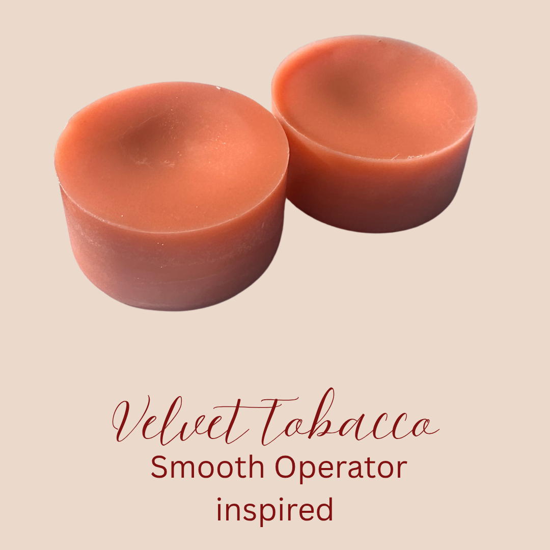 Two round, peach-coloured wax melts shown on a light beige background with text reading 'Velvet Tobacco Smooth Operator inspired'.